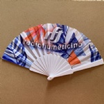 white plastic fan with advertising logo