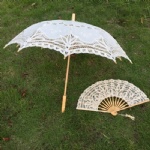beige lace umbrella and lace fan
